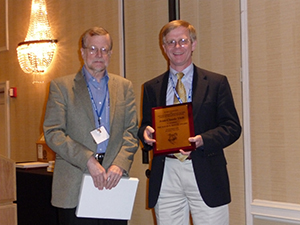 jean-claude Jean-Claude Thill (right) recieving a plaque from Vernon Henderson
